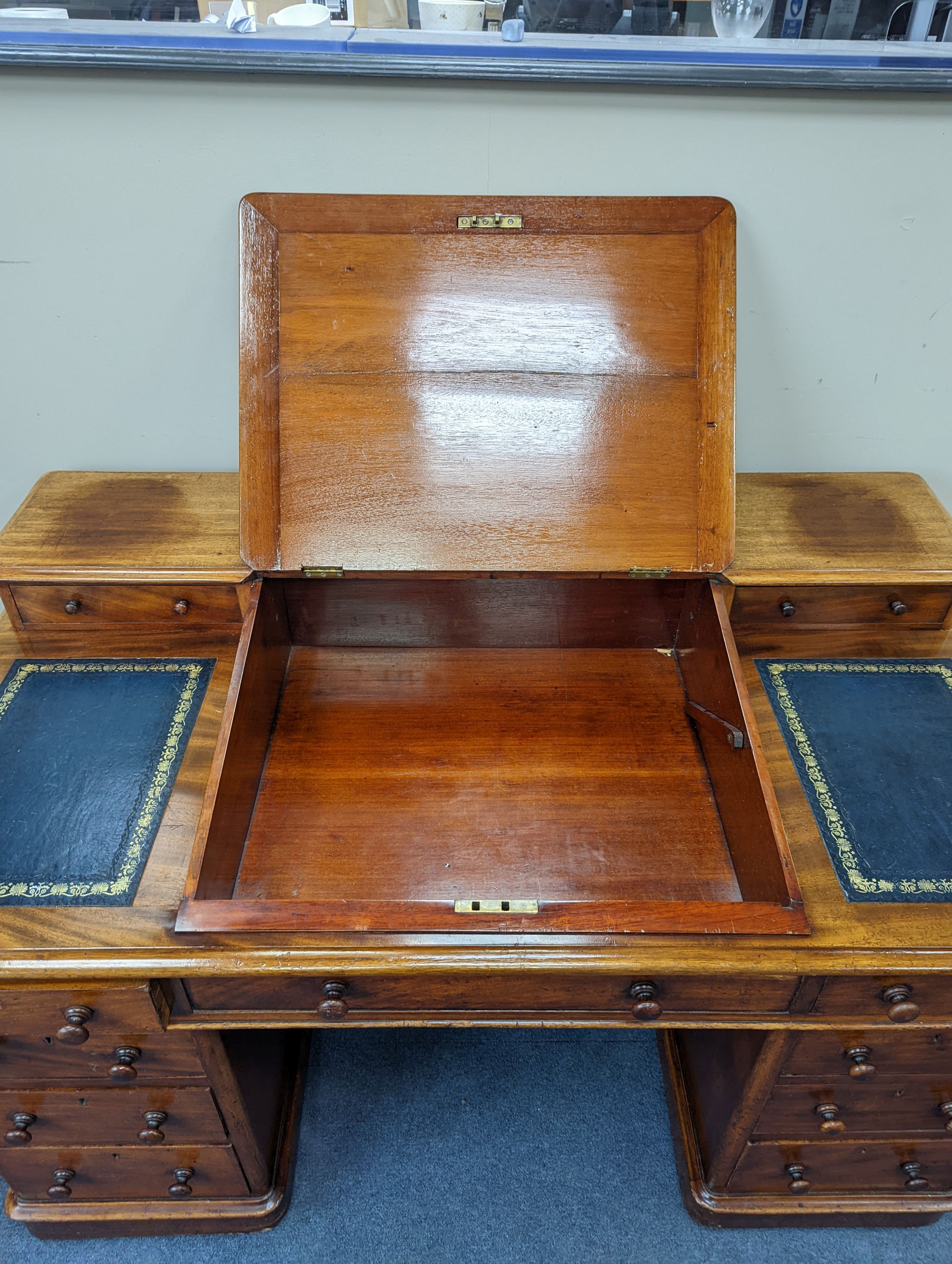 A Victorian ‘Dickens’ mahogany pedestal desk, width 137cm, height 87cm